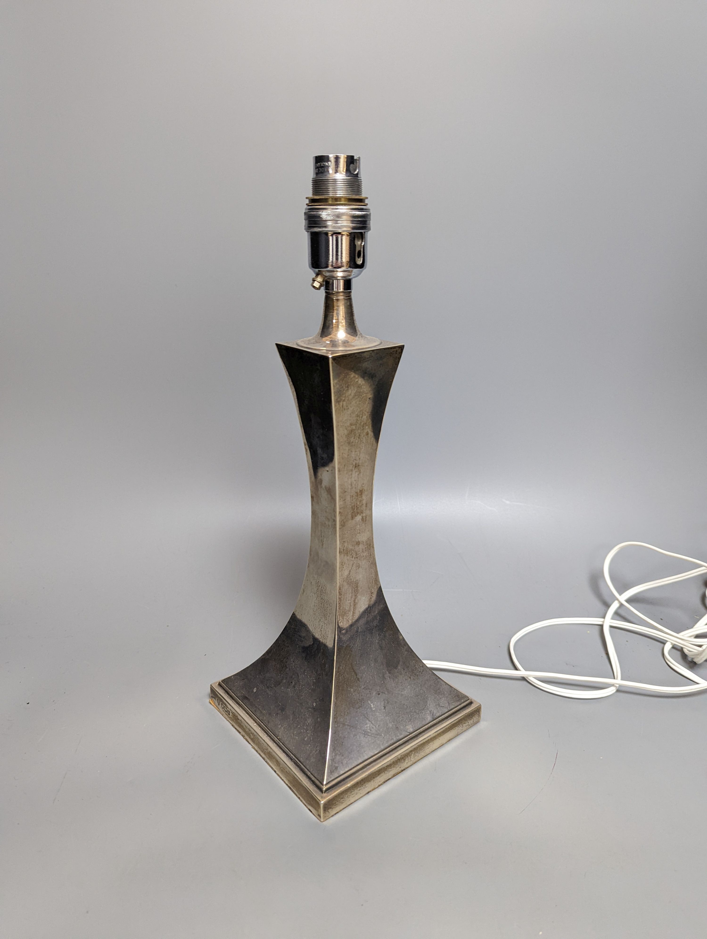 A George V silver lamp base, Hawksworth, Eyre Ltd, Sheffield, 1925, overall height 35cm.
